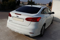 Ford Focus III 2011-2017 гг. Накладка на задний бампер Sedan 2015↗ (грунтованная под покраску) фото 1