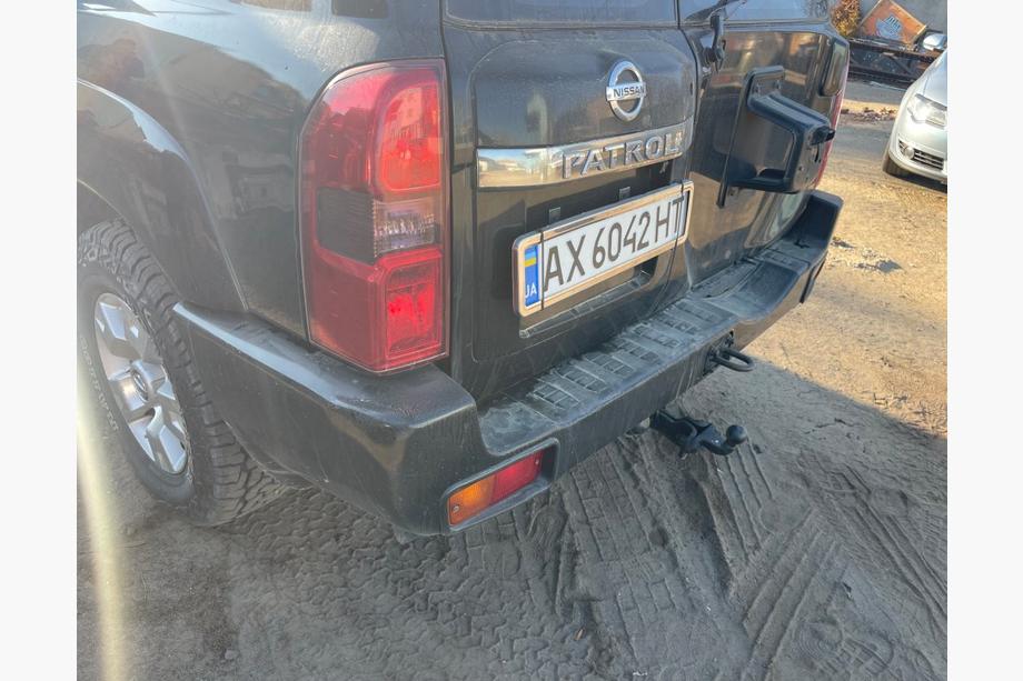 Nissan Patrol Y61 1997-2011 гг. Задний бампер в сборе б/у (2004-2008) Image