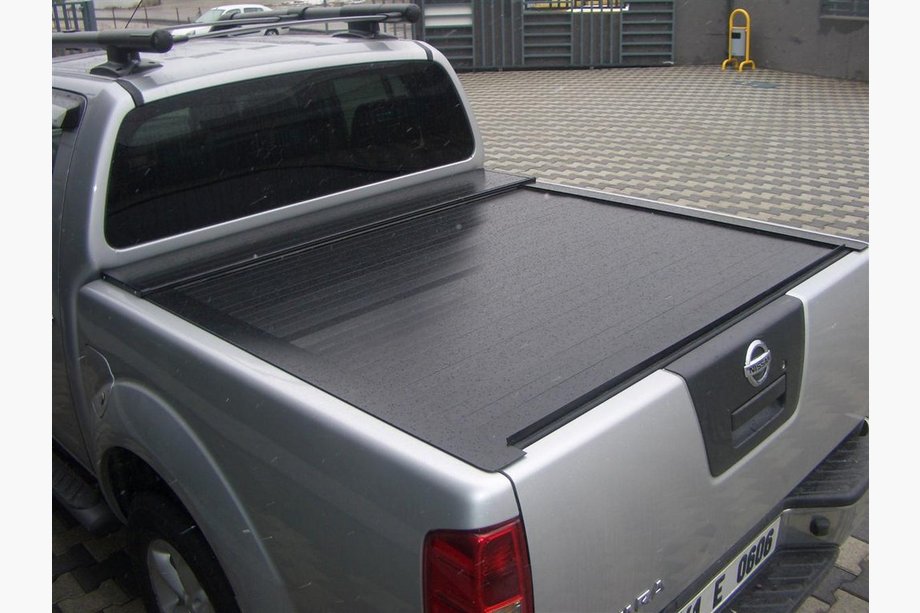Nissan Navara 2006-2015 гг. Рулонная Крышка Image