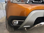 Dacia Duster 2018-2024 гг. Накладки на противотуманные фары (2 шт., нержавейка) фото 1