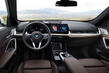 Обзор компактного электрокросовера BMW iX1 фото 5
