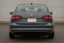 Volkswagen Jetta 2011-2018 гг. Накладка над номерным знаком (Carmos нержавейка) фото 1
