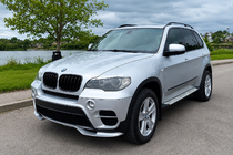 BMW X5 E70 2007-2013 гг. Накладка на передний бампер (2010-2013, грунтованная под покраску) фото 1