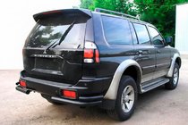 Mitsubishi Pajero Sport 1996-2007 гг. Задние двойные угловые дуги Black (2 шт, нерж) фото 1