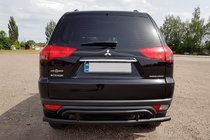 Mitsubishi Pajero Sport 2008-2015 гг. Задняя защита AK002-2 Черный (2 шт, нерж. сталь) фото 1