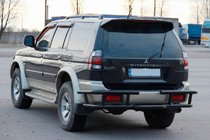 Mitsubishi Pajero Sport 1996-2007 гг. Задняя защита AK-Special Black (нержавейка) фото 2