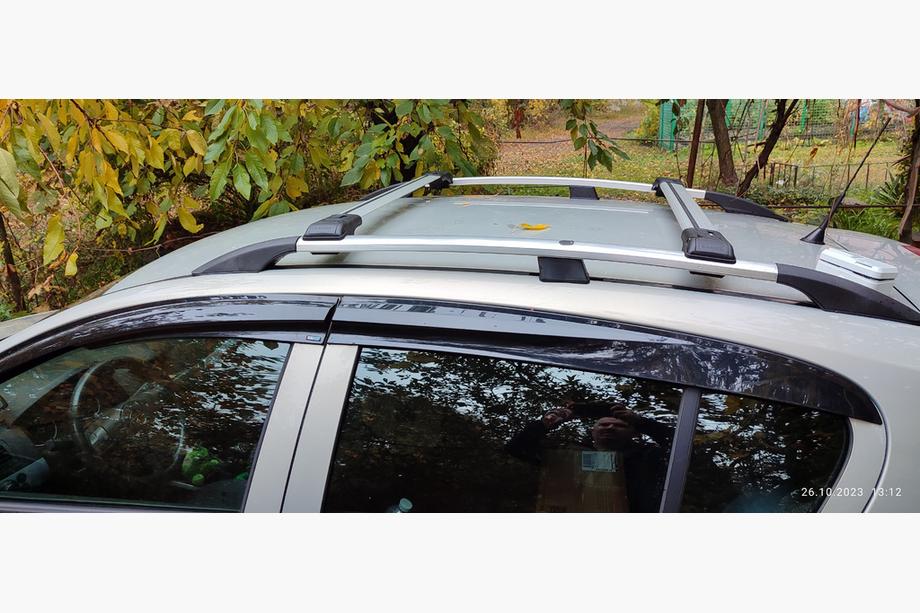 Opel Astra H 2004-2013 гг. Поперечные дуги на стандартные рейлинги с замком (2 шт) Серый Image