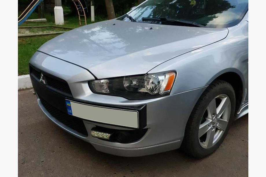 Mitsubishi Lancer X 2008- гг. Рамка для номера (пластик) Черный Матовый Image