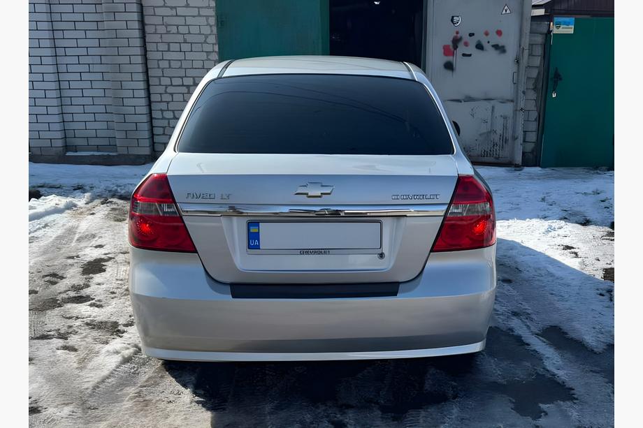 Chevrolet Aveo T250 2005-2011 гг. Накладка на задний бампер с загибом Пластик Image